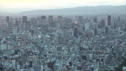 OSAKA, JAPAN - CIRCA SEPTEMBER 2019 : Aerial high angle view of CITYSCAPE of OSAKA in early evening sunset time. Osaka is the second largest metropolitan area in Japan.