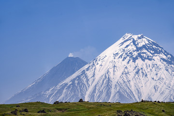 Fototapeta na wymiar The Kamchatka volcano. Klyuchevskaya hill. The nature of Kamchatka, mountains and volcanoes.