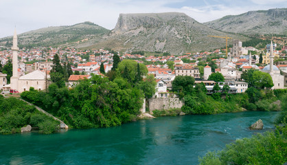Fototapeta na wymiar Beautiful view on Mostar city with Neretva river and architecture in Bosnia and Herzegovina