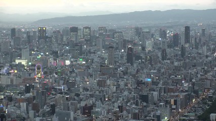 OSAKA, JAPAN - CIRCA SEPTEMBER 2019 : Aerial high angle view of CITYSCAPE of OSAKA in early evening sunset time. Osaka is the second largest metropolitan area in Japan.