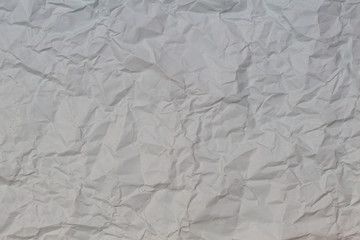 Light grey crumpled wrinkled paper texture background