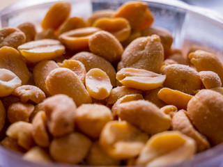 Lots of roasted and salted peanuts - selective focus
