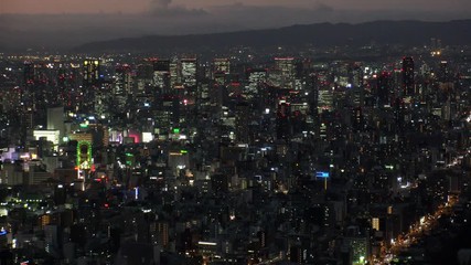 OSAKA, JAPAN - CIRCA SEPTEMBER 2019 : Aerial high angle view of CITYSCAPE of OSAKA in night time. Osaka is the second largest metropolitan area in Japan.