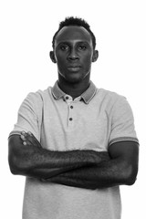 Young black African man with arms crossed