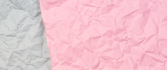 Pastel pink and light grey crumpled wrinkled paper texture background