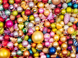 Many multi-colored christmas toys background texture. Top view.