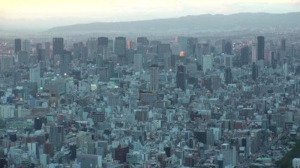 OSAKA, JAPAN - CIRCA SEPTEMBER 2019 : Aerial high angle view of CITYSCAPE of OSAKA. Time lapse shot, sunset to night. Osaka is the second largest metropolitan area in Japan.