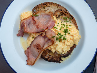 Bacon and scrambled eggs on toast