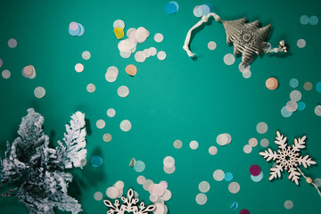 Fototapeta na wymiar Green christmas background, decorations top view