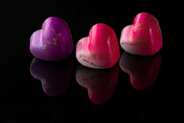 Chocolate candy for Valentine’s day on black