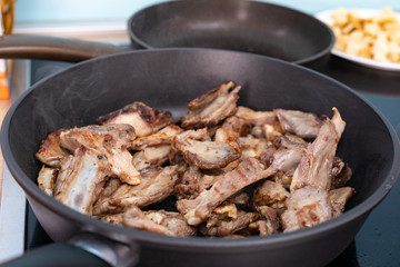 Rack of lamb barbecue on black grilled pan. Process the roasting meat. Grilled food.