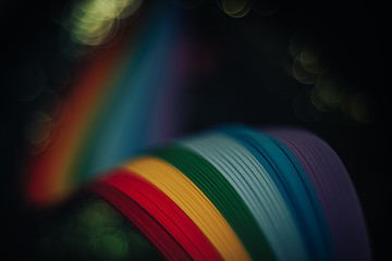 Beautiful abstract rainbow bridge and multi colored space background in the darkness.