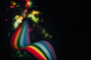 Beautiful abstract rainbow bridge and multi colored space background in the darkness.