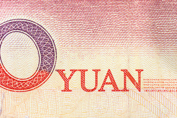 Close up macro photograph of Yuan word on the Chinese currency note.  