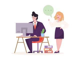 Young man sitting at the desk and working on computer