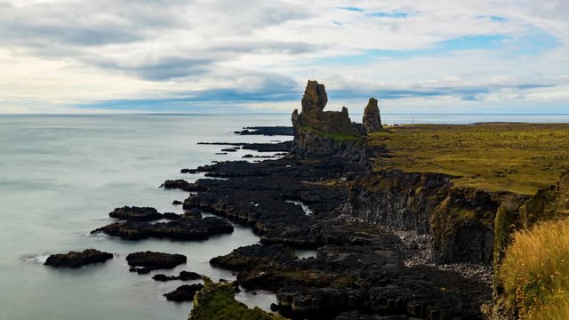 Timelapse view of a rocky beach with volcanic basalt formations in West Iceland