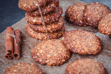 Homemade healthy oat cookies with cinnamon on brown parchment. Healthy food concept. Healthy snack
