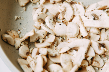  Cooking and slicing mushrooms. Content and macro photography for food blog.