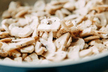  Cooking and slicing mushrooms. Content and macro photography for food blog.
