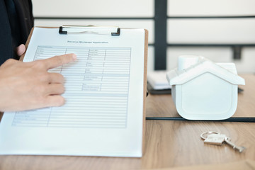 realtor man show mortgage loan.  real estate agent house developer present application form. sale & purchase property