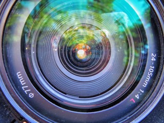 Camera lens on blue background