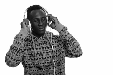 Young black African man listening to music with eyes closed