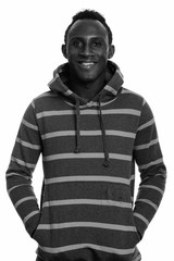 Studio shot of young African man in black and white