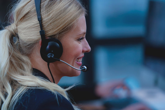 Customer service agent  woman with headset Working In a Call Center.    