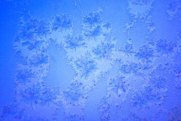 Fototapeta na wymiar Textural abstract background of frozen glass.