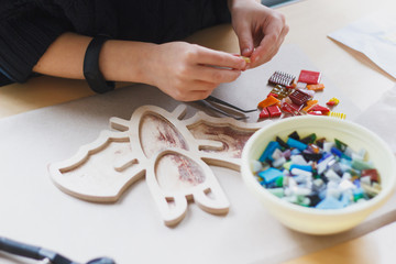 The process of creating a mosaic bat.