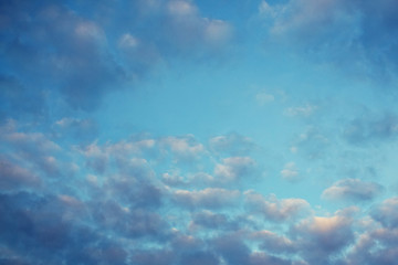 Naklejka na ściany i meble Blue sky, pink clouds, sunset.