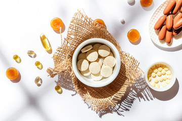 Nutritional supplements and vitamins on white background. Medicines for health support. Pills and supplements for people health.