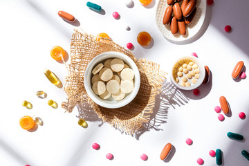 Nutritional supplements and vitamins on white background. Medicines for health support. Pills and supplements for people health.