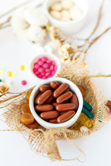 Nutritional supplements and vitamins on white background. Medicines for health support. Pills and supplements for people health.