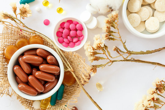 Nutritional Supplements And Vitamins On White Background. Medicines For Health Support. Pills And Supplements For People Health.