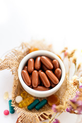 Nutritional supplements and vitamins on white background. Medicines for health support. Pills and supplements for people health.