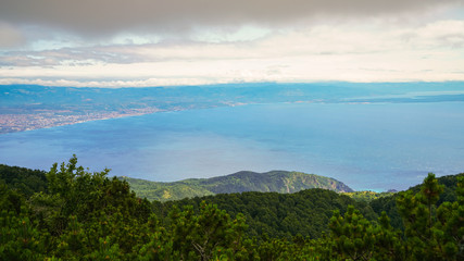 The eastern part of the Istrian peninsula, the island of Krk is visible on the right. View from the top of Mount Voyak
