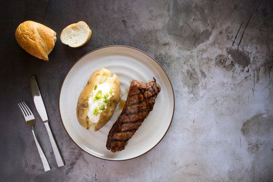 Grilled Steak And Loaded Baked Potato