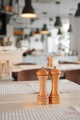 Salt and pepper on the table in the restaurant