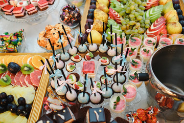 Candy bar decorated with fruit and biscuits.