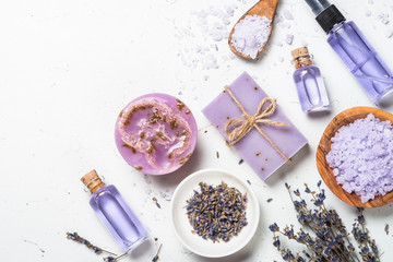 Lavender cosmetics on white top view.