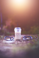 Coffee and shoes with nature in the morning