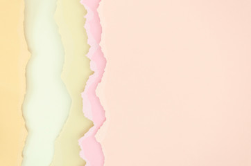 Naklejka premium Torn ripped of pastel tones paper creased crumpled posters grunge textures surface backdrop