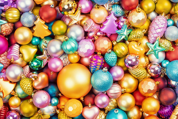 Many multi-colored christmas toys background texture. Top view.