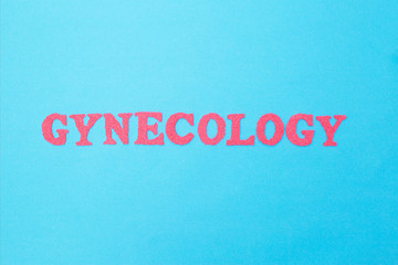 Fototapeta na wymiar Gynecology inscription in red letters on a blue background. The concept of female diseases of the reproductive organs. surgical treatment of diseases of the reproductive female system