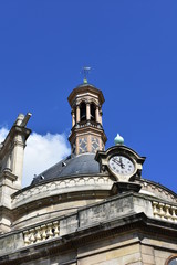 Fototapeta premium Church of Saint Eustache. South East detail, bell tower and clock. Paris, France.