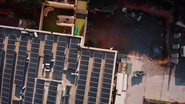Rooftops with Solar Panels Aerial view Drone footage over Rooftops with Solar Panels