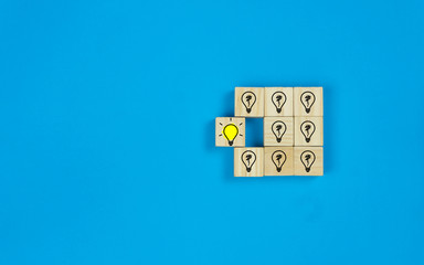 Creative ideas concept. Conceptual different thinking or leadership. One shining light bulb and...
