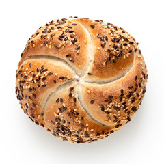 Traditional white kaiser roll with linseeds and sesame seeds isolated on white. Top view. - obrazy, fototapety, plakaty