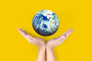 Globe ,earth in  hand, holding our planet glowing. Earth image provided by Nasa